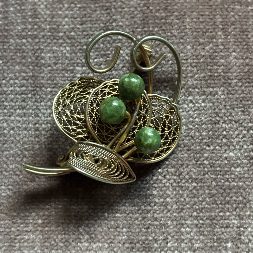 Elegant Gold and Green Brooch
